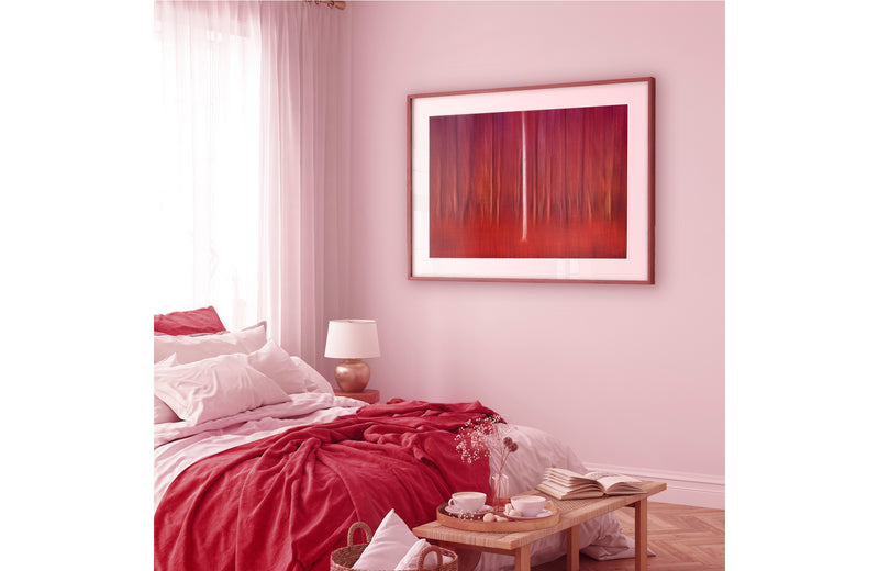 Framed abstract art hanging in bedroom