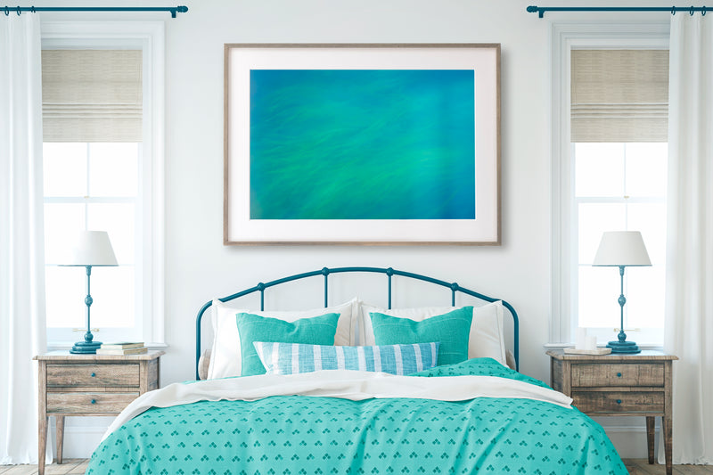 Framed Landscape art hanging in bedroom